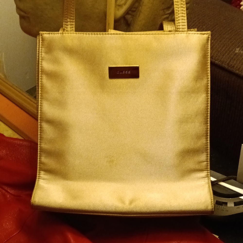 Small Guess purse.  Golden beige.  Good condition.